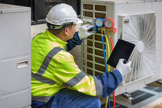 Professional Air Conditioning Repair technician working in Beecher, MI